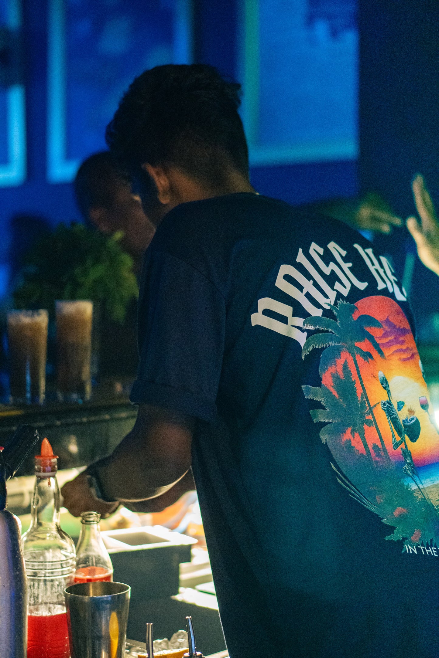 Drunkenlankan dark blue oversized T-shirt with tropical skeleton design. (hospitality mentality)